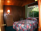 cabin bedroom with landscape view.