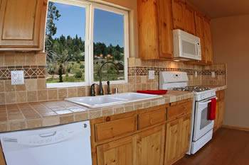 tumbled marble kitchen with tree view.