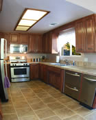 kitchen with stainless and custom cabinets.